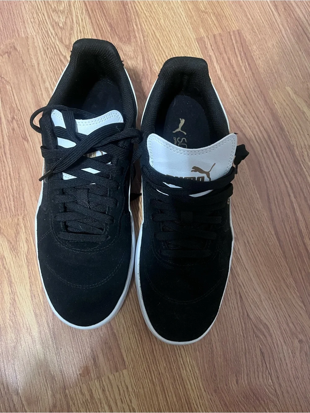 Puma Black Suede Sneakers with White Tongue and Gold Logo